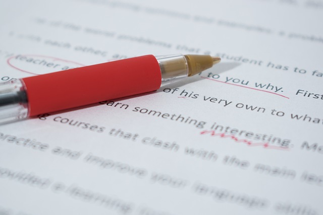 Professional proofreading corrections on a document with a red pen
